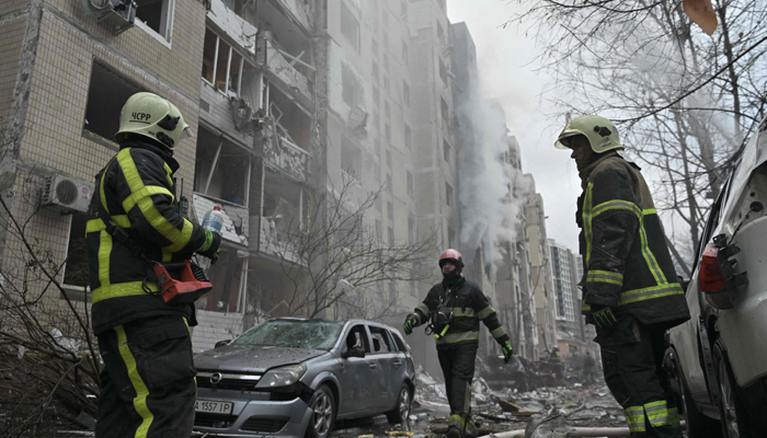 Firefighters try to extinguish a fire in a multi-story residential building destroyed by a missile attack in central kyiv, January 2, 2024. — AFP
