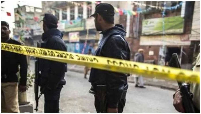 Cops stand near a crime scene in Pakistan in this undated picture. Photo: Screengrab via Geo News/ File