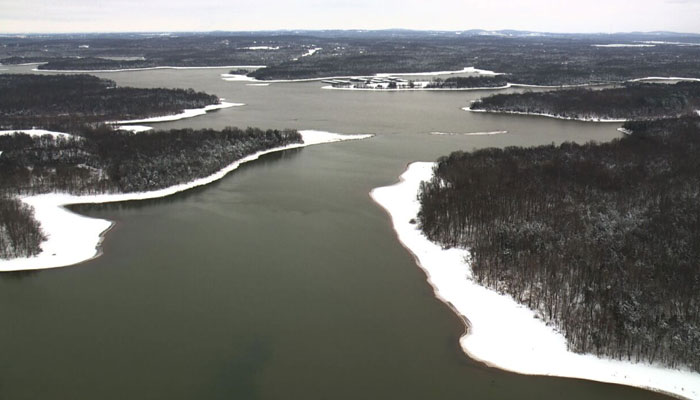 The banks of the Cumberland River and the woods around it are covered in snow on January 16, 2024. — WTVF/Sky5