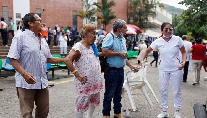 Medical personnel of the Primavera clinic helps to evacuate patients after a strong earthquake in Villavicencio, Colombia, on August 17, 2023. —Reuters