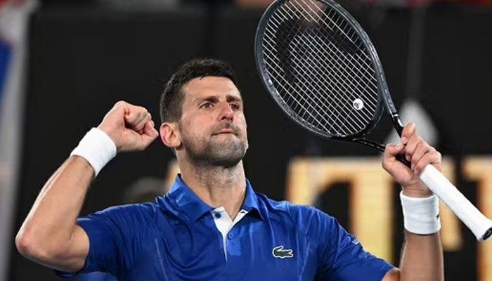 Serbian tennis star Novak Djokovic celebrates after victory against Argentina’s Tomas Etcheverry during their mens singles match in Australian Open on January 19, 2024. — AFP