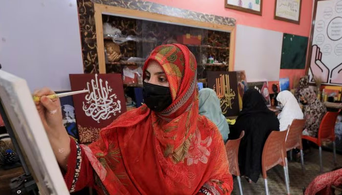 An Afghan girl attends a painting and art class at the Skills Academy for Needy Aspirants (SANA) in Peshawar, Pakistan July 12, 2023. — Reuters