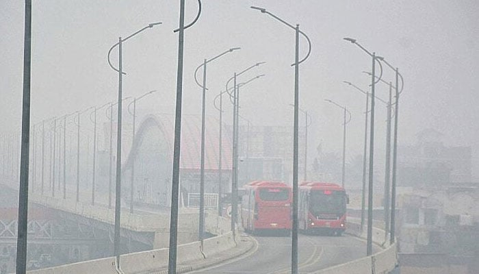 Thick fog engulfs roads, buildings, and the metro bus track in Rawalpindi. — Online/File