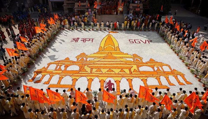 Students of Swaminarayan Gurukul Vishwavidya Pratishthanam stand around the formation of a Ram temple during celebrations in Ahmedabad, India, January 22, 2024. — Reuters