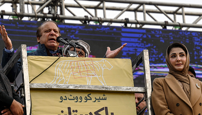 PML-N supremo Nawaz Sharif (left) addresses a gathering as his daughter Maryam Nawaz looks on during an election campaign rally at Mansehra on January 22, 2024. — AFP