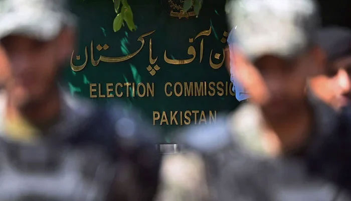 Paramilitary soldiers stand in front of the Election Commission of Pakistans headquarters in Islamabad. — AFP