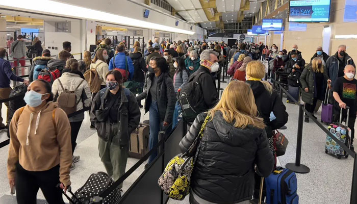 Passengers wait at Ronald Reagan Washington National Airport in Virginia over Presidents Day weekend. The TSA screened more than 2 million people on Friday and Sunday. — AFP