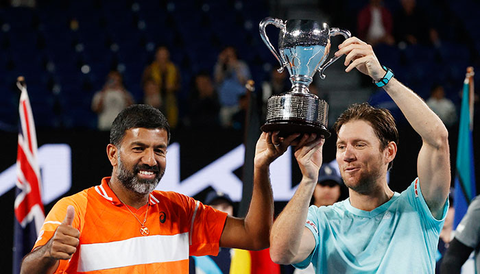 Indias Rohan Bopanna (left) and Australias Matthew Ebden celebrate with the trophy after winning the mens doubles final against Italys Simone Bolelli and Andrea Vavassori in the Australian Open at Melbourne Park, Australia, on January 27, 2024. — Reuters