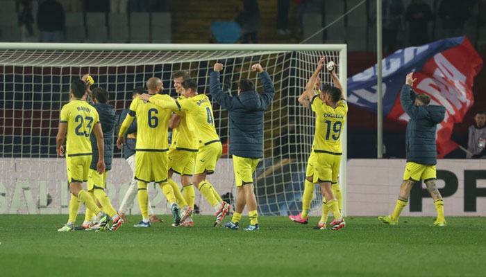 Villarreals players celebrate their thrilling 5-3 victory over Barcelona in La Liga on Saturday at the Olympic Stadium. — AFP