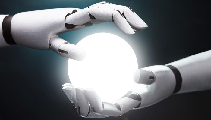 This representational image shows an illustration of a glowing ball in a robots hands. — Unsplash