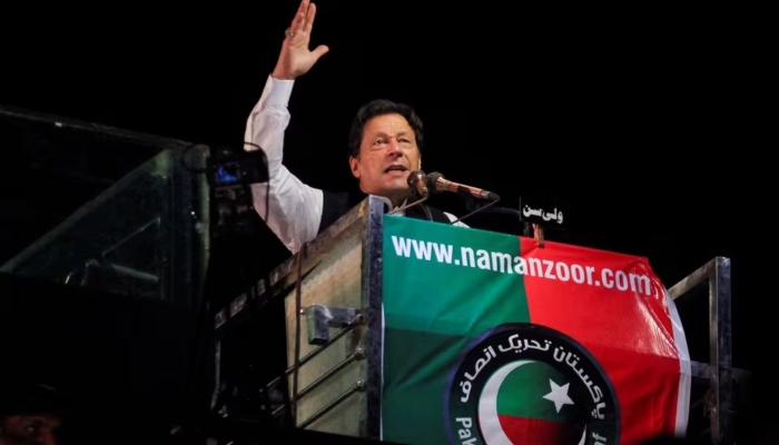 PTI founder Imran Khan gestures as he addresses supporters during a rally, in Lahore, on April 21, 2022. —Reuters