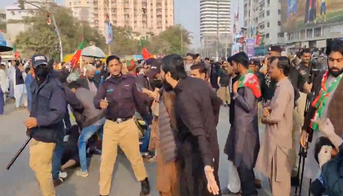 The picture shows PTI workers clashing with police in Karachi on January 28, 2024. — X/@PTIofficial