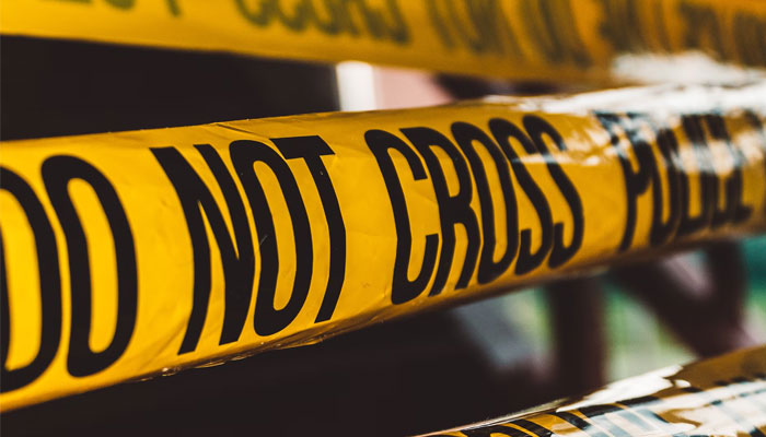 This representational image shows a crime scene tape. — Unsplash