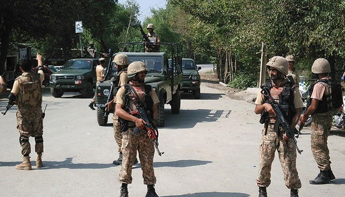 In this representational file photo, Pakistani soldiers cordon off a street leading to Christian colony following an attack by suicide bombers on the outskirts of Peshawar on September 2, 2016. — AFP