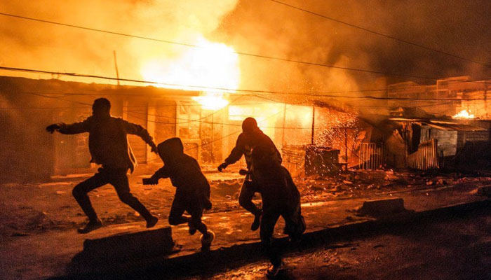 People run after the Nairobi gas explosion in Kenya on Feb 2, 2024. — AFP