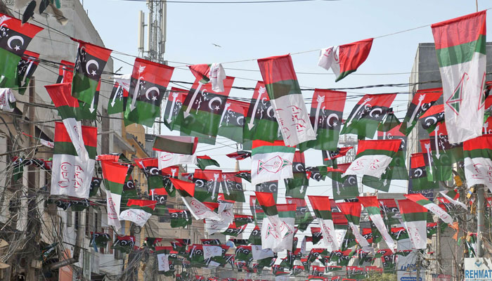 Flags of MQM-P and PPP in an area of Karachi. —Online/ File