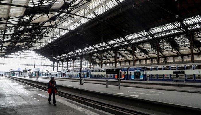 An SNCF employee walks on an empty platform of the Gare de Lyon train station in Paris on April 3, 2020, during a COVID-19 lockdown in France. — AFP