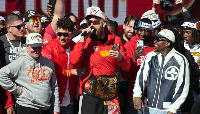 Kansas City Chiefs tight end Travis Kelce (87) addresses the crowd on stage during the celebration of the Kansas City Chiefs winning Super Bowl LVIII in Kansas City, Missouri, US, before the shooting on February 14, 2024. — Reuters