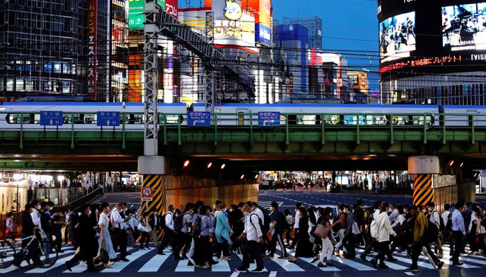 People cross a road in Shinjuku, Tokyo, Japan, June 3, 2021. — Reuters