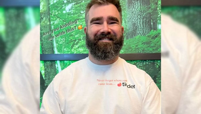 Jason Kelce smiles wearing a white Tinder shirt in this undated photo.—Instagram@Kylie Kelce