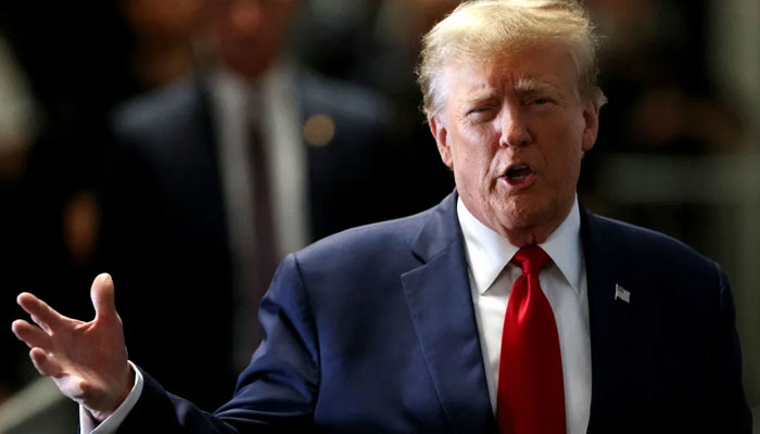 Former President Donald Trump gestures on the day of a court hearing in New York on February 15, 2024. — Reuters