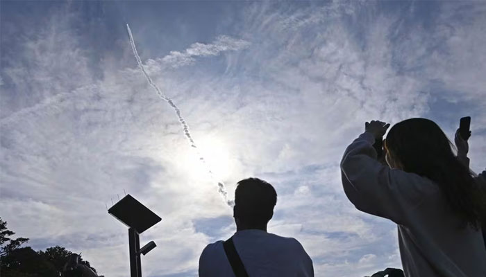 In this photo taken by Kyodo, a second test model of the H3 rocket rises into the air after taking off from the launch pad at the Tanegashima Space Center as people look on, on the southwest island of Tanegashima, Kagoshima Prefecture, Japan , on February 17, 2024. – Reuters