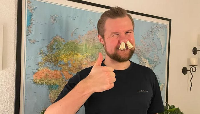 Peter von Tangen Buskov poses with matchsticks up his nose — his new-found talent. —  Guinness World Record
