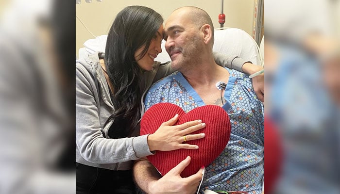 Former NBA player Scot Pollard with his wife Dawn before getting surgery for his heart transplant. — X/@DawnMPollard