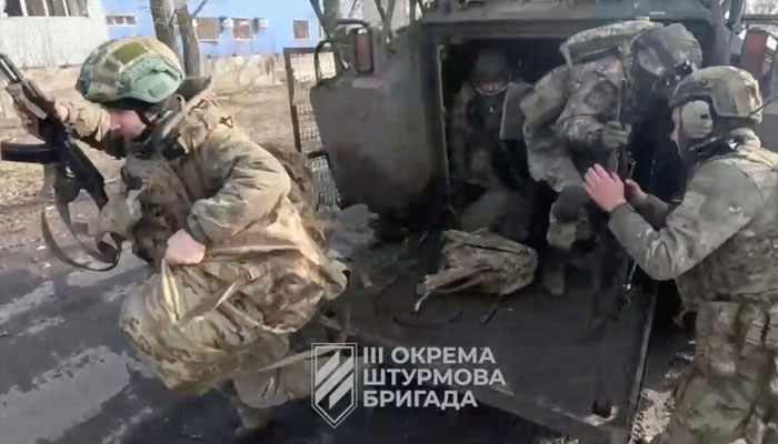 Ukrainian soldiers get out of a military vehicle in a location given as Avdiivka, Donetsk Region, Ukraine, in this screen grab taken from a video released February 17, 2024.—Reuters