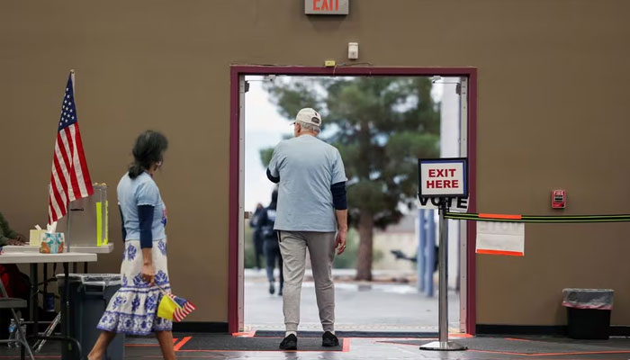 Volunteers watch for voters to arrive shortly after the polls open as Democrats and Republicans hold their presidential primary election in Las Vegas, Nevada, US, February 6, 2024. —Reuters