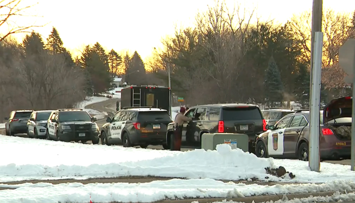 This still shows police vehicles parked in Burnsville where three officials were killed in a domestic incident on February 18, 2024. — CBS Minnesota Wocco