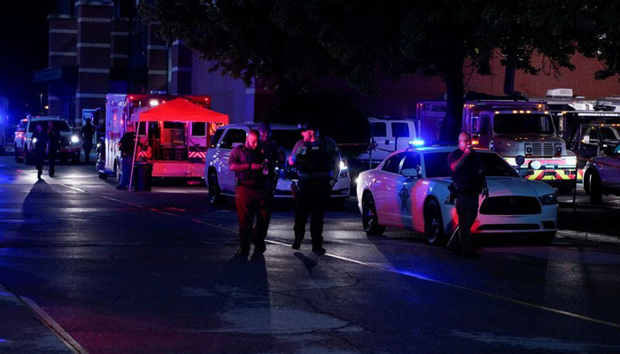 Law enforcement officers walk near the crime scene after a shooting at a mall in the Indianapolis suburb of Greenwood, Indiana, US. — Reuters/File