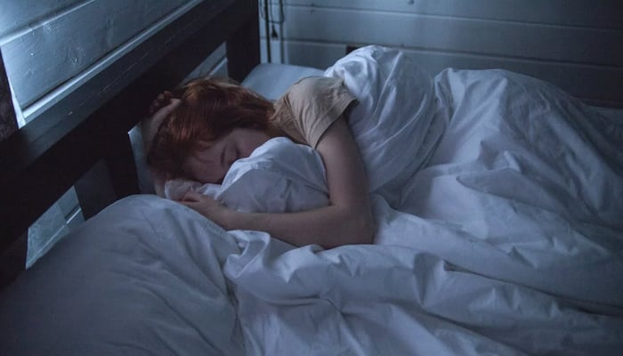 A representational image of a person while sleeping. — Pexels