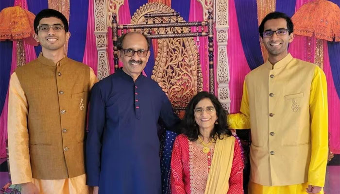 Ashwin Ramaswami (left) with his parents and brother.  — Ashwin for Georgia
