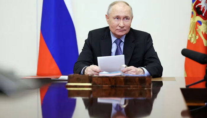 Russian President Vladimir Putin chairs a meeting with members of the Security Council via video link at the Novo-Ogaryovo state residence outside Moscow, Russia February 13, 2024. — Sputnik