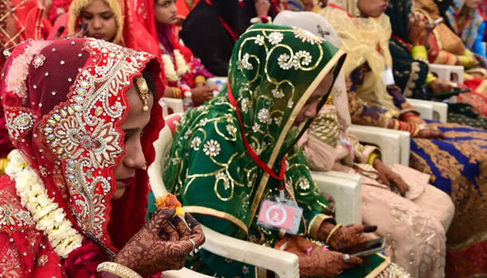 Brides attend a mass Islamic marriage ceremony organised by the Gujarat Sarvajanik Welfare Trust in Ahmedabad on 4 February 2024. — AFP
