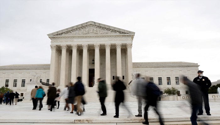 People walk across the plaza to enter the U.S. Supreme Court building on the first day of the courts new term in Washington, U.S. October 3, 2022. —Reuters