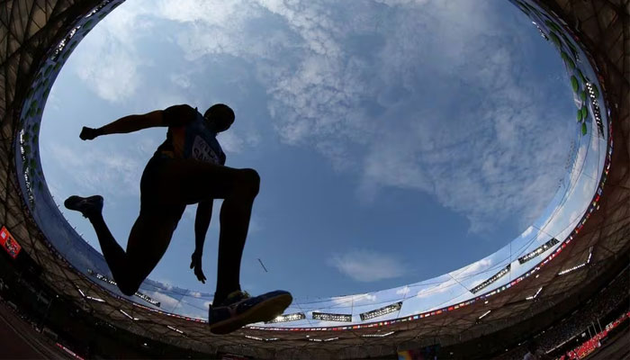 An athlete competes in the mens triple jump during the 15th IAAF World Championships at the National Stadium in Beijing, China, August 26, 2015. —Reuters