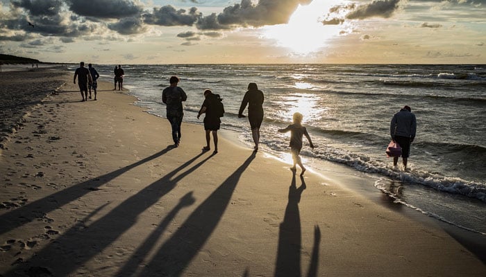 A representational image showing a family hanging out at a beach. — Pixabay