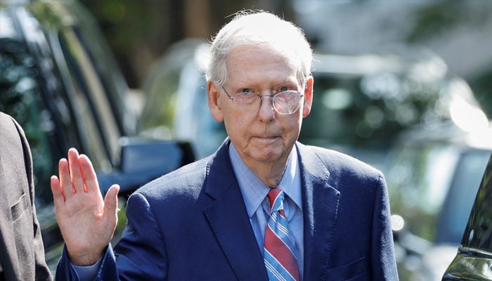 US Senate Leader Mitch McConnell (R-KY) waves as he leaves his home in Washington to return to work in the US Senate.  —Reuters