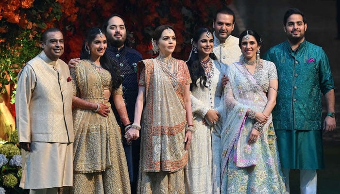 The Ambani family, from (left to right) Mukesh, Radhika Merchant, Anant, Nita, Isha, Anand Piramal, Shloka Mehta, and Akash. — AFP/File