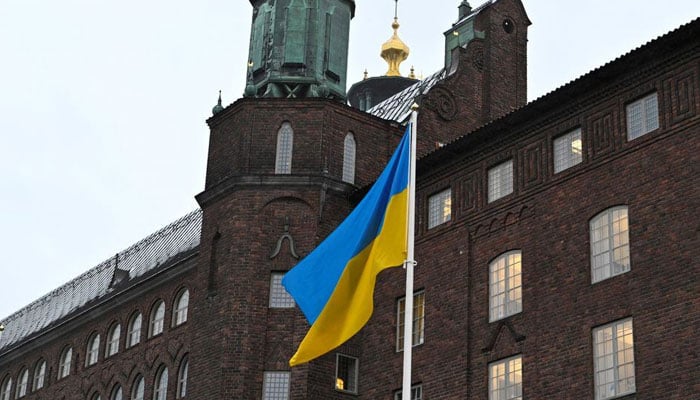 The flag of Ukraine waves in the wind at City Hall, in Stockholm, Sweden February 24, 2022. — Reuters