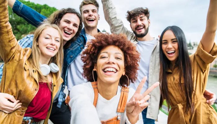 A representational image depicting a group of friends posing for a photograph. — iStockphoto/File