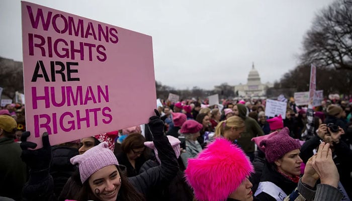 A demonstrator holds a sign during a gathering at the National Mall during the Womens March in Washington DC, US, on January 21, 2017. —Bloomberg