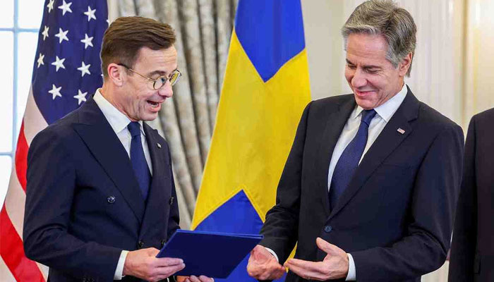 Swedish Prime Minister Ulf Kristersson hands over final documents to US secretary of State Anthony Blinken. — Reuters/File