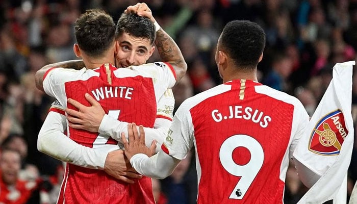 Arsenals Kai Havertz is mobbed by teammates after scoring the teams second goal against Brentford. —  AFP