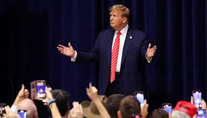 Republican presidential candidate and former President Donald Trump gestures as he hosts a campaign rally at the Forum River Center in Rome, Georgia on March 9, 2024. — Reuters