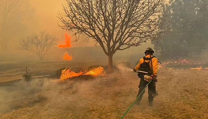 Effects of climate change include droughts, wildfires, sea levels rising, more intense heat waves and extreme weather events such as tropical storms.—AFP/FIle