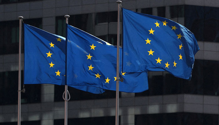 European Union flags fly outside the European Commission headquarters in Brussels, Belgium, April 10, 2019. — Reuters