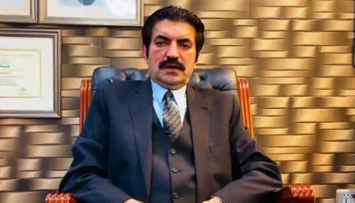 PTI leader and MNA Sher Afzal Marwat is seen seated in his office in this still taken from a video. — X/@sherafzalmarwat